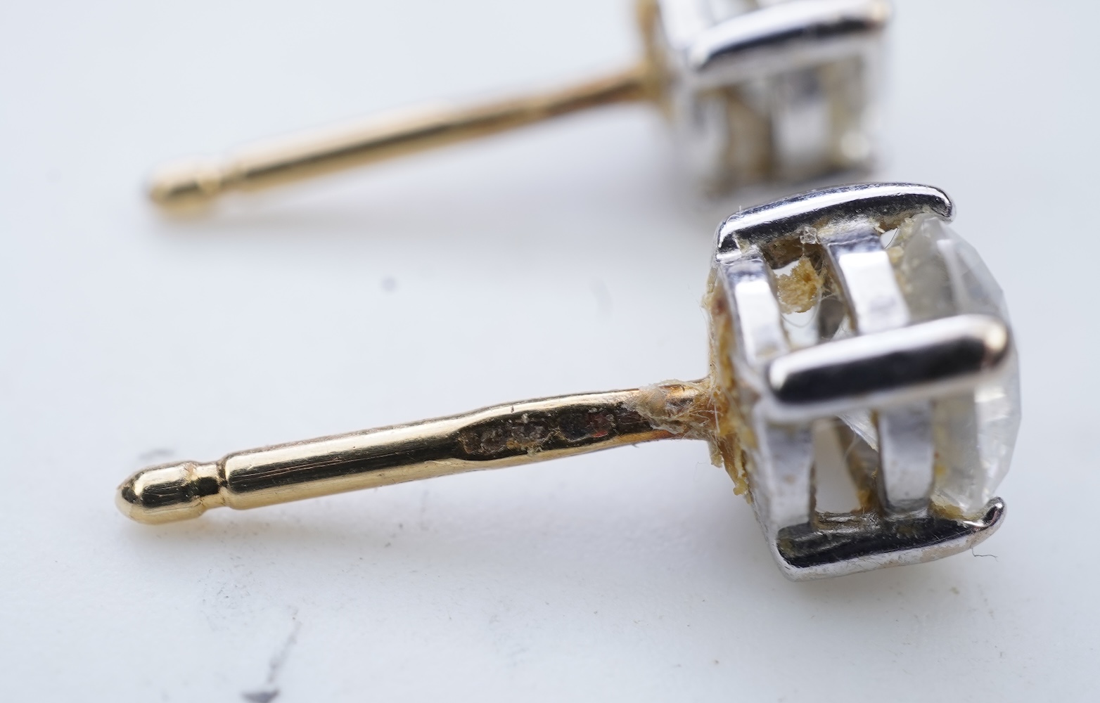 A pair of diamond stud earrings
